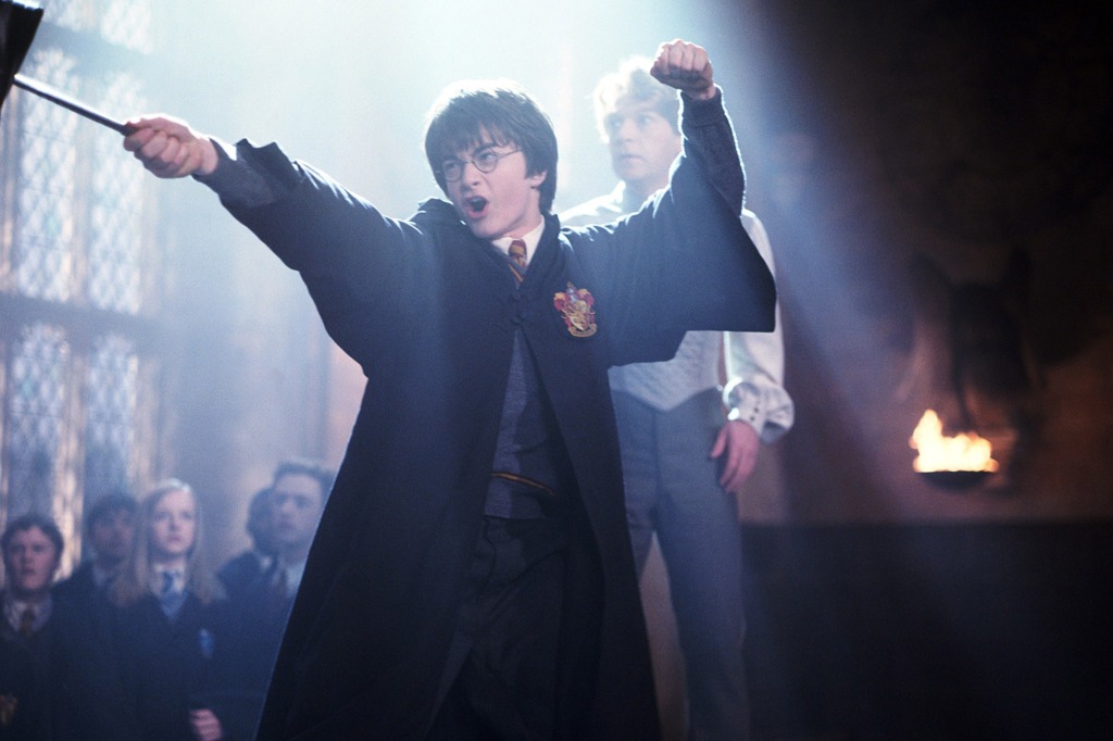 Harry Potter wears his Hogwarts uniform.